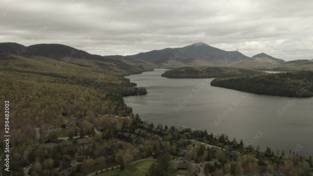 Drone shot, flying forward and panning up and to the right, showing a big lake. Drone shot, flying forward and panning up and to the right, showing a big lake.