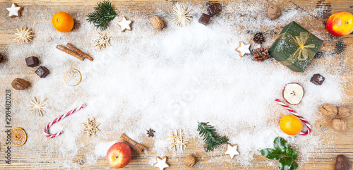 snow on wooden table with christmas decoration, winter