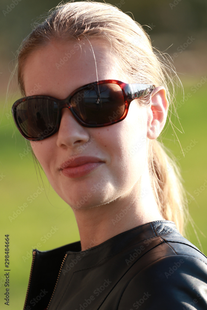 Modell portrait out in nature with sunglasses Modell portrait out in nature with sunglasses