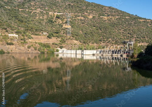 Solid structure of the Valeira dam on River Dourowith lock and gates on the left photo