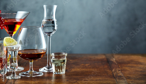 Fotografie, Obraz Assorted alcoholic beverages on rustic bar counter