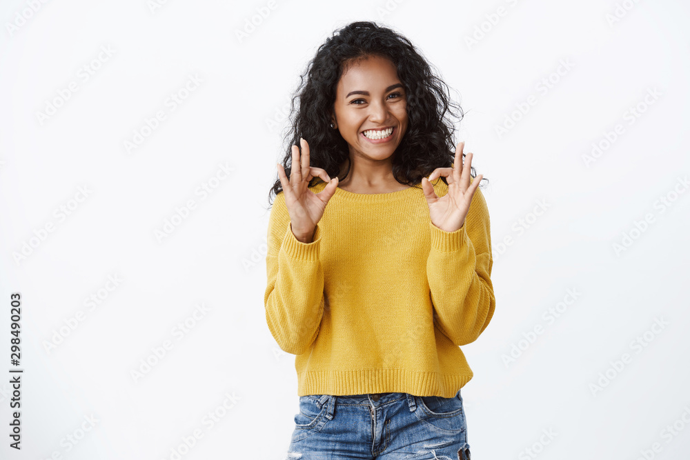 Ταπετσαρία Cheerful pleased dark-skinned girl student in yellow sweater smiling with approv