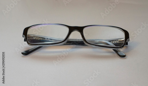 a pair of glasses on a piece of paper