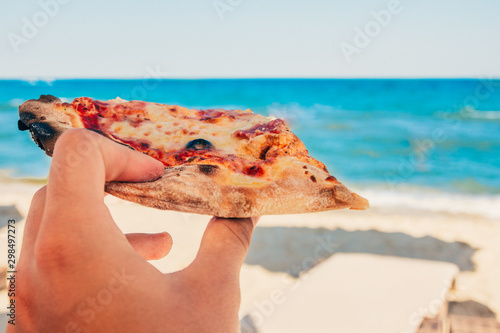 eating pizza at the beach