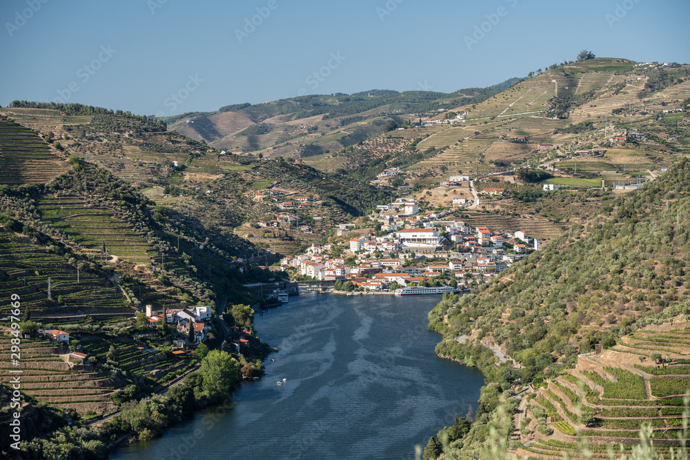 Village of Pinhao on bend in river among the hillsides of the Douro valley in Portugal