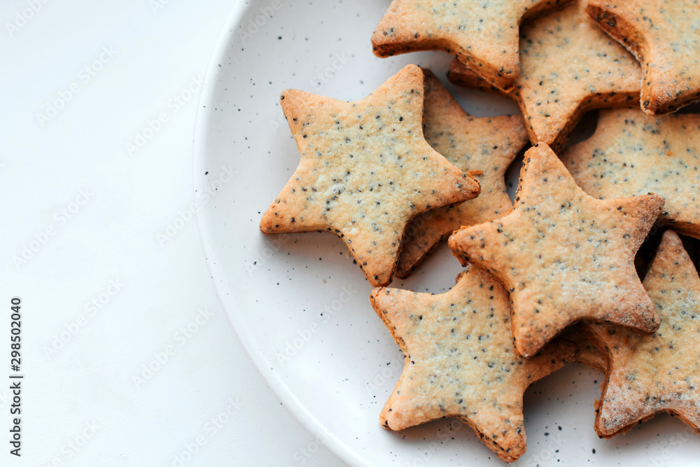  Star-shaped cookies on a white plate.