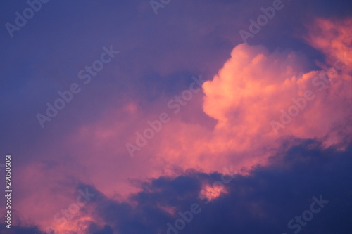 Beautiful sky and clouds in dark blue and pink in the evening for background and decoration