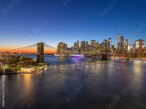 New York City downtown buildings skyline Brooklyn Bridge evening night © blvdone