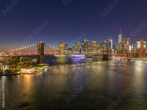 New York City downtown buildings skyline Brooklyn Bridge evening night