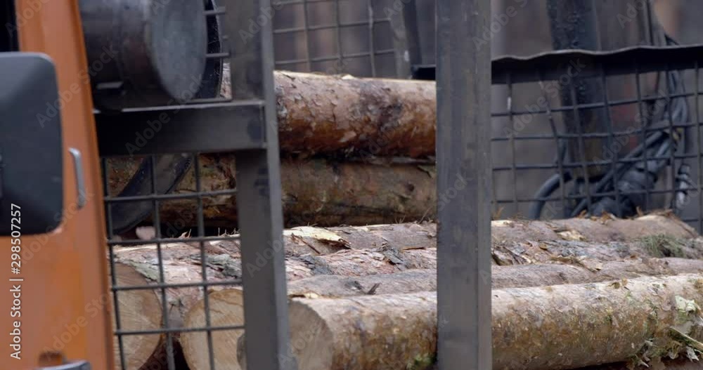 Industrial wood crusher. Processing of wood. Crushing of a tree. Outdoor pallet recycling sawmill plant for pellet processing using machinery