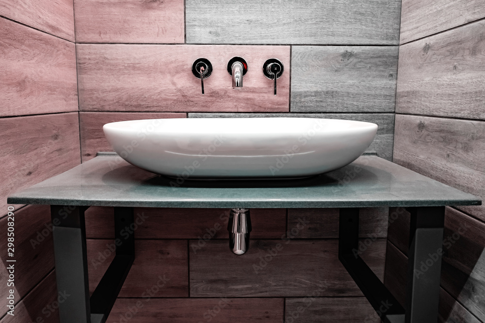 Fototapeta premium Classic modern white washbasins with chrome water tap and soap dish.