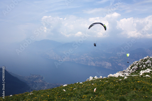 Paraglider over Lake Garda, Italy, on a summer day