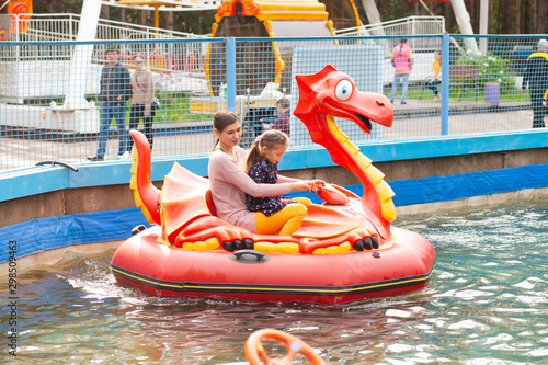 Mom and daughter ride on the water attraction © Stanislaw Mikulski