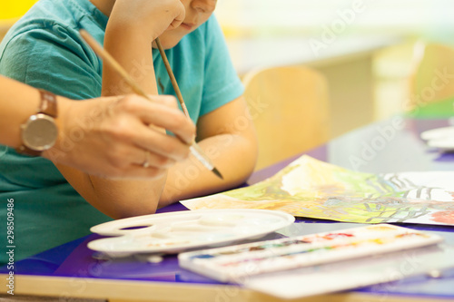 A lesson in watercolor painting for preschool children