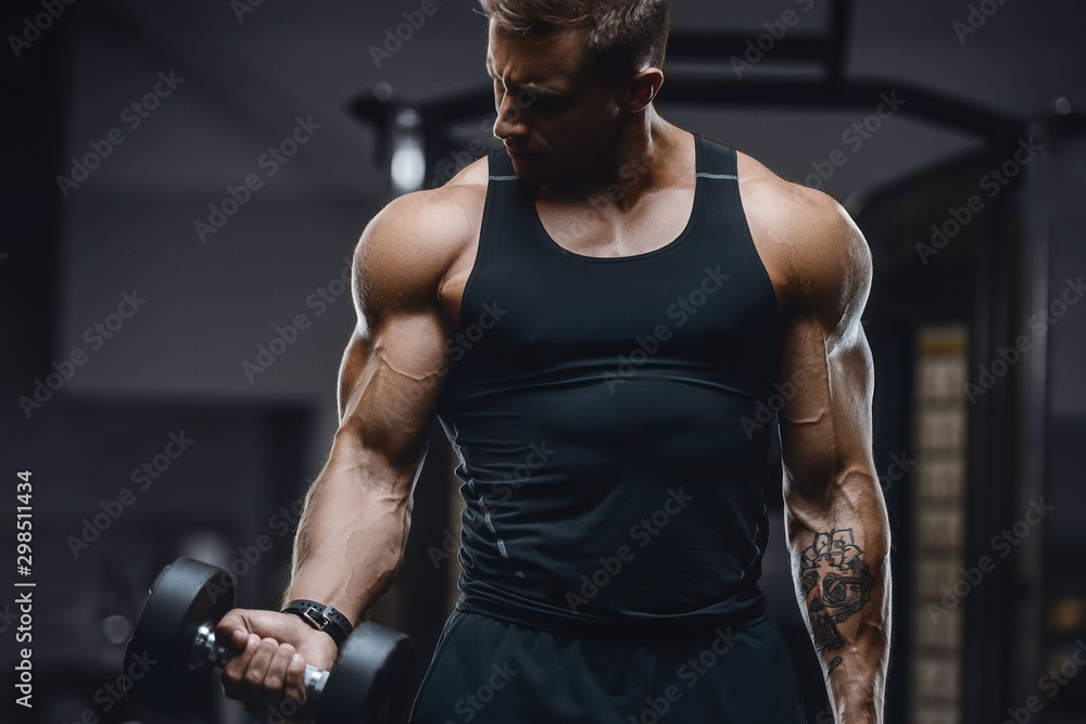 Handsome strong athletic men pumping up muscles workout fitness and  bodybuilding concept background - muscular bodybuilder fitness men doing  arms abs back exercises in gym naked torso. Photos