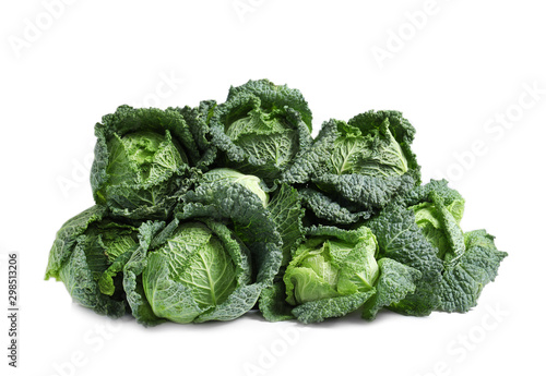 Pile of fresh savoy cabbages on white background
