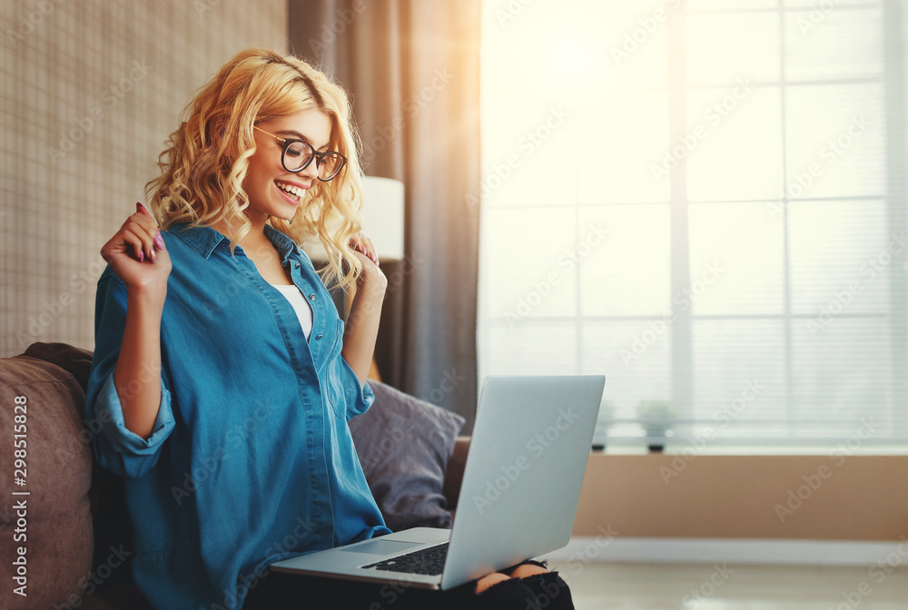 attractive young girl working at computer, happy to win. attractive young girl working at computer, happy to win.