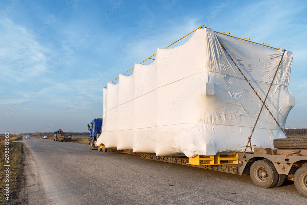 Truck with large oversized cargo on rural road