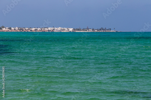 Turquoise and warm waters in Tunisia with a view of an island. © GeorgeVieiraSilva