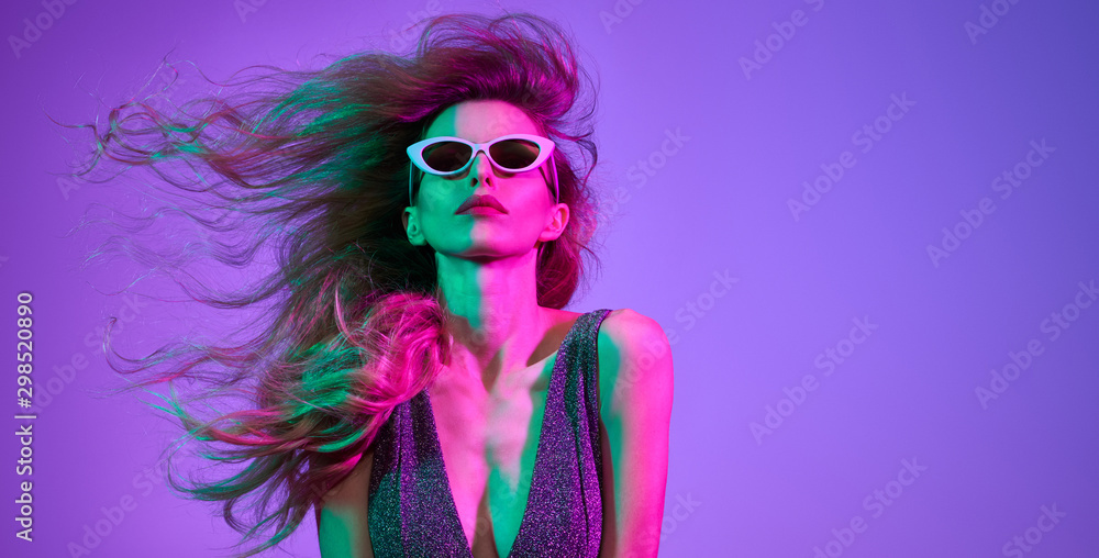 Fashionable glamour woman with Trendy wavy neon light hairstyle. Party night club vibes, gel filter. Excited shapely girl dance. Bright pink green lighting. Art fashion creative neon color. - obrazy, fototapety, plakaty 