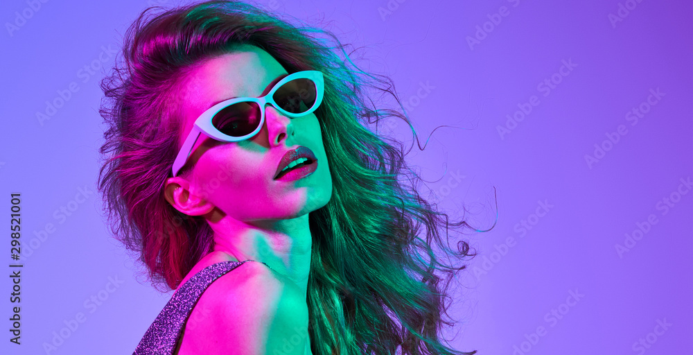 Fashion contemporary neon style. Graceful Beautiful woman in party bodysuit dance. Disco summer vibes. Adorable fashionable sexy model. Fitness girl, trendy gel filter neon color. Creative art light