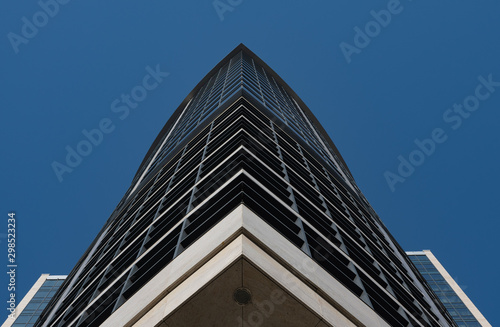 View of the skyscraper from below against a blue sky