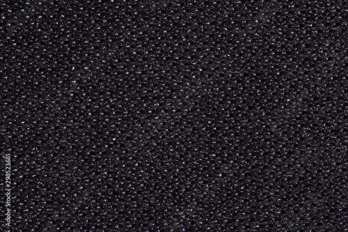 Abstract background. Black Kevlar fabric close-up. Macro photography photo