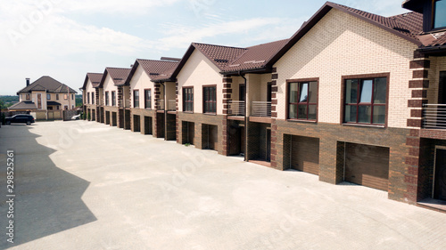 A row of a new townhouses near the pine forest