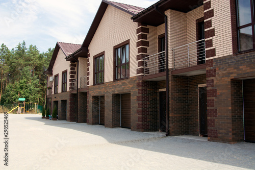 A row of a new townhouses near the pine forest