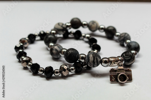 Beautiful bracelet with a camera pendant. Bracelets of hematite and black stone. Grey and black bracelets.