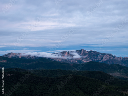 bluish sunset aerial landscape with mountains and mists