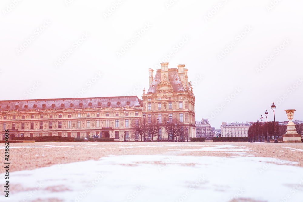 Louvre museum in Paris and snow on the ground