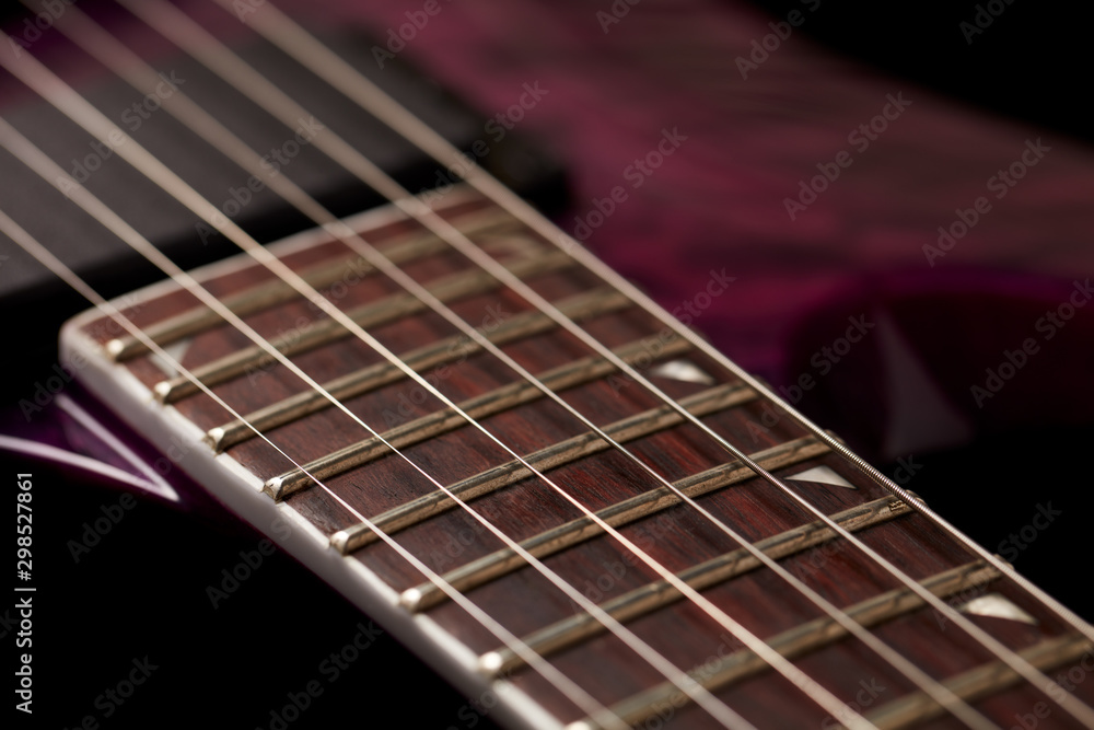 Fretboard of modern electric guitar on black background. Fretboard of modern electric guitar on black background.