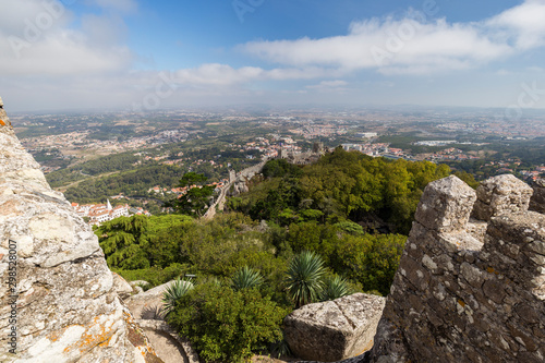 Scenic view of medieval hilltop castle Castelo dos Mouros (The Castle of the Moors) and Sintra municipality and beyond from above in Portugal.