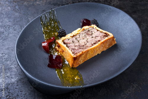Schilderij op canvas French pate en croute with goose liver, fruit relish and jelly as closeup on a m