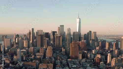 Aerial CU shot of Lower Manhattan business district skyscrapers at sunrise