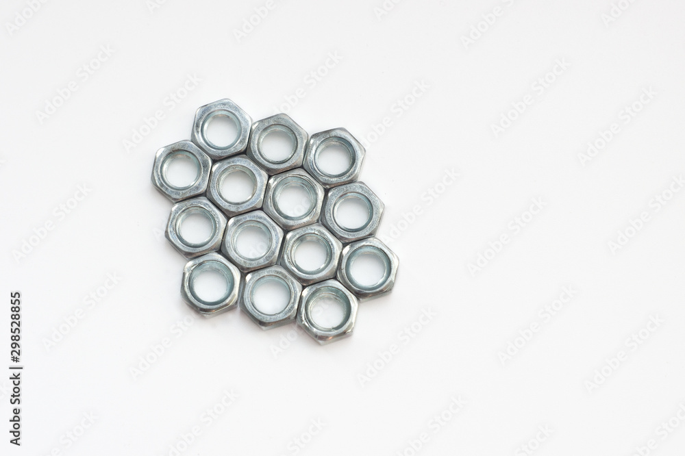 silver nuts on a white background.Flat lay. silver nuts on a white background.Flat lay.