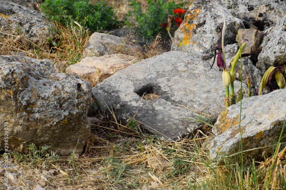 Fragments of ancient buildings, ruins of the ancient city of Hierapolis. Stone blocks with traces of stone machining. Fragments of ancient buildings, ruins of the ancient city of Hierapolis. Stone blocks with traces of stone machining.