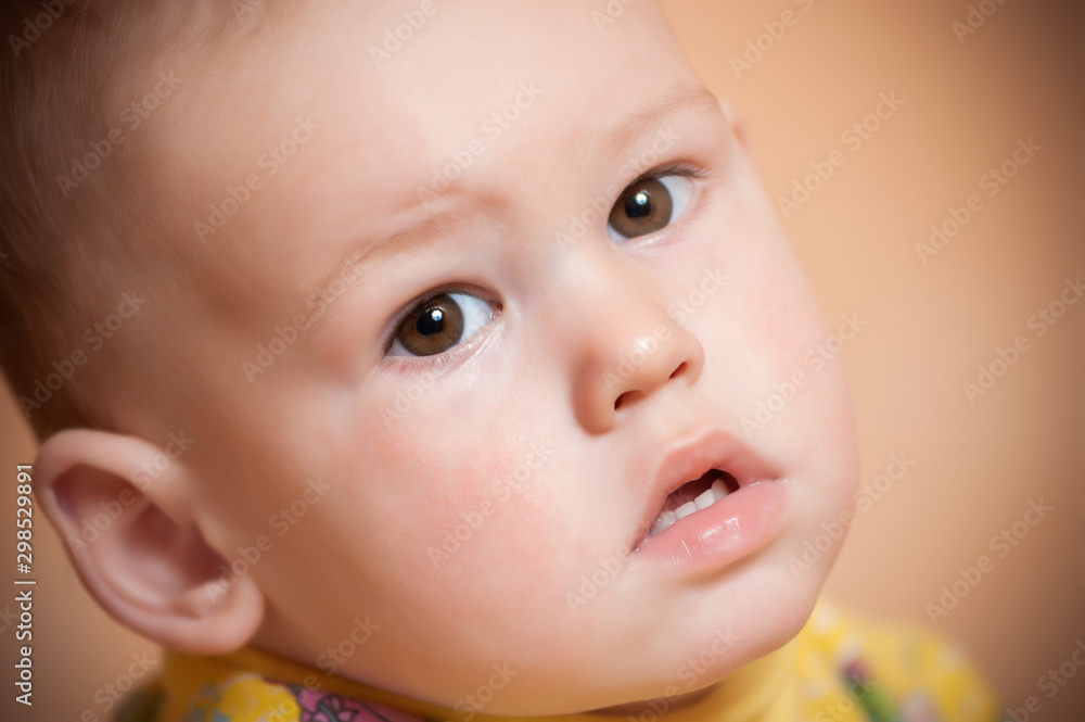 Home portrait of an one-year-old child at home. Home portrait of an one-year-old child at home.