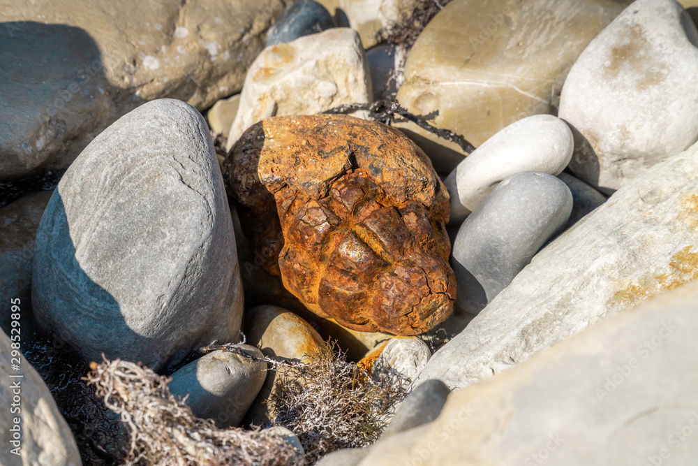 The old strongly porzhavshaya from time and water pomegranate f-1-accidental finding in stones on the beach have Gelendzhik. The old strongly porzhavshaya from time and water pomegranate f-1-accidental finding in stones on the beach have Gelendzhik.