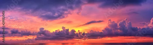 Obraz  z motywem Phuket beach sunset, colorful cloudy twilight sky reflecting on the sand gazing at the Indian Ocean, Thailand, Asia.