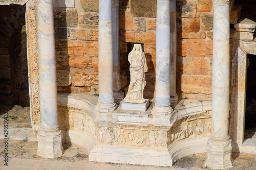 Marble statues at the columns of the amphitheater in Hierapolis, Turkey.