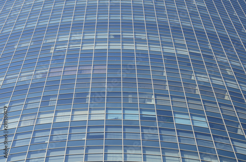 Modern architectural background of the glass facade of the building