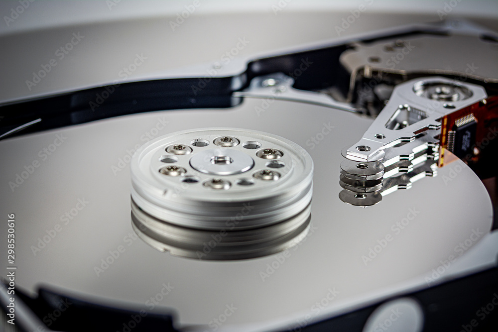 disassembled hard drive on white background, hdd, hard disk drive, close-up disassembled hard drive on white background, hdd, hard disk drive, close-up