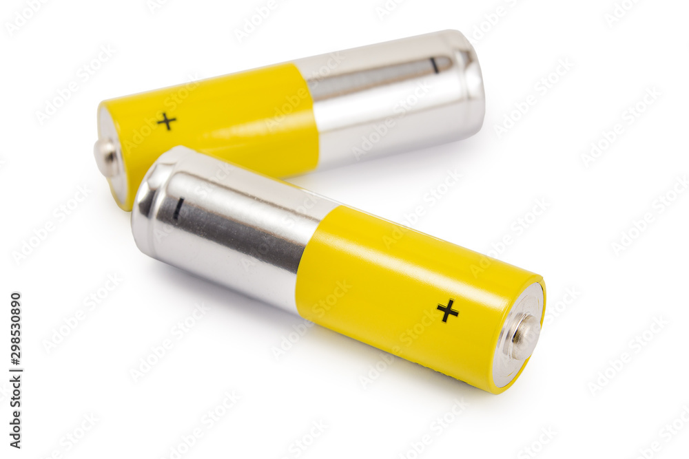 alkaline batteries and a yellow metal AA-size batteries isolated on white background closeup, carbon zinc batteries, rechargeable batteries, mockup alkaline batteries and a yellow metal AA-size batteries isolated on white background closeup, carbon zinc batteries, rechargeable batteries, mockup