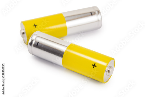 alkaline batteries and a yellow metal AA-size batteries isolated on white background closeup, carbon zinc batteries, rechargeable batteries, mockup
