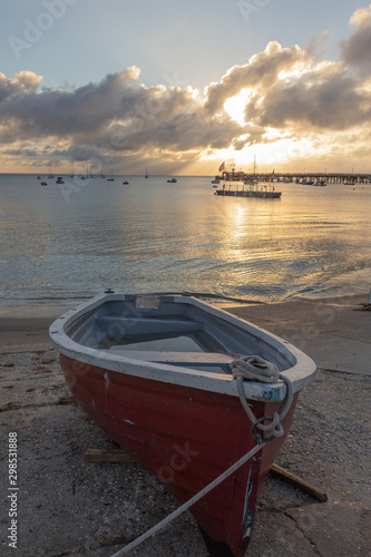 Valokuva Little red boat at the dawn seaside
