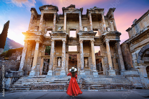 Woman standing in Celsius Library at Ephesus ancient city in Izmir, Turkey. photo