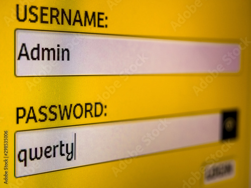 Closeup of login and password screen on LED pc display. Silly login in text boxes - Username: Admin / Password: qwerty