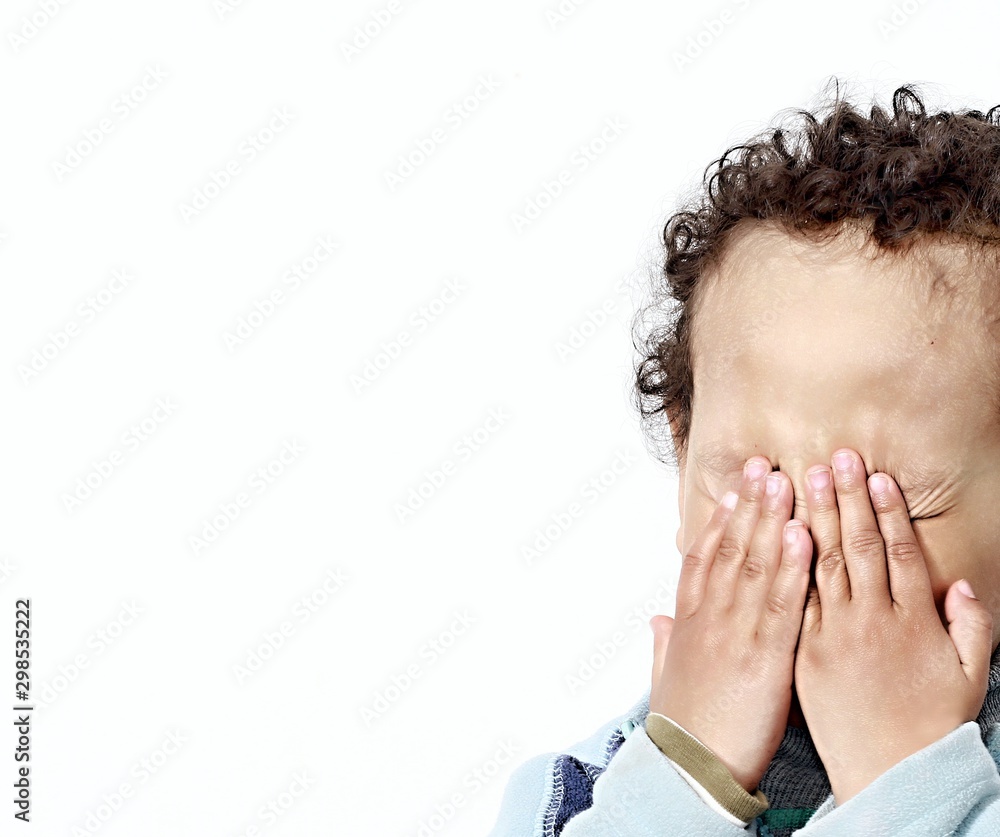 boy crying poverty with no help crying alone and all by himself on white background stock photo boy crying poverty with no help crying alone and all by himself on white background stock photo